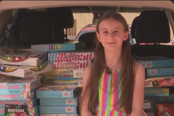 Girl Brings Joy to Kids' Hospital with Over 100 Game Donations